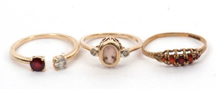 Three 9ct gemset rings: to include a 9ct five stone garnet ring hallmarked Birmingham 1993, size