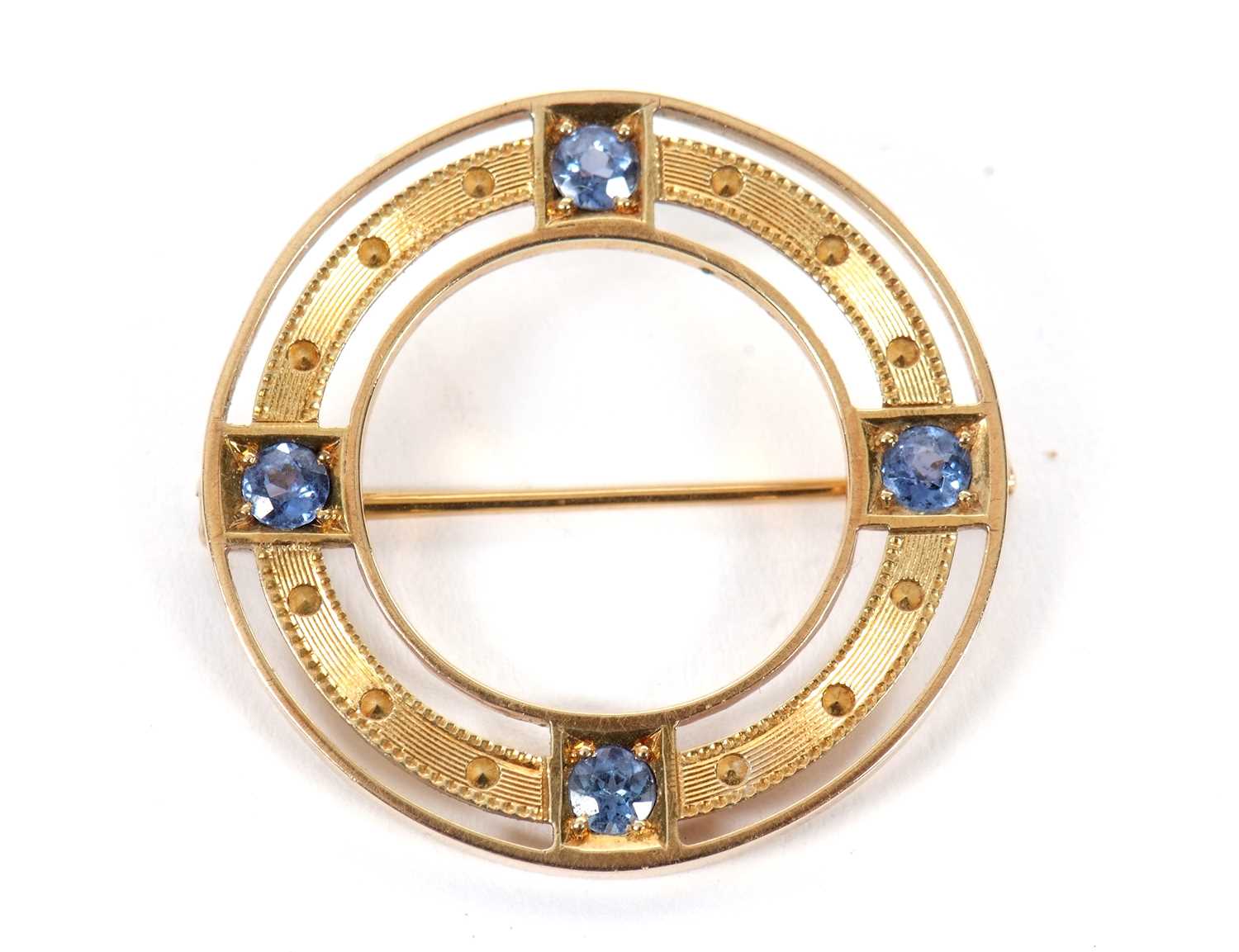 A late 19th/early 20th century sapphire brooch, the ring set with four pale blue sapphires, all - Image 3 of 4