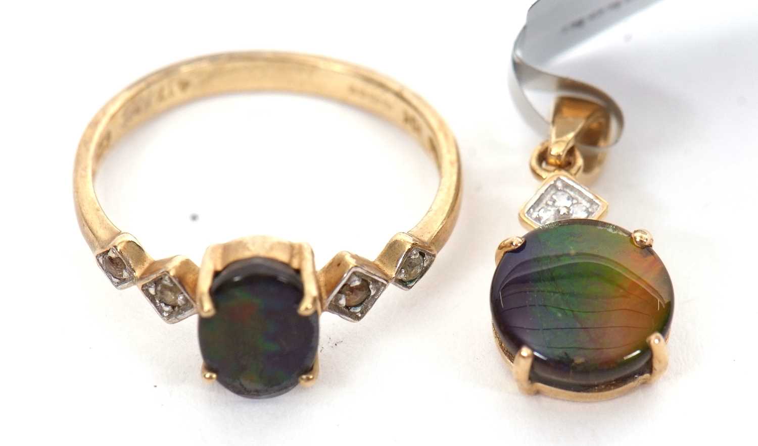 A 9ct opal triplet ring and a matching 10K pendant, the oval opal triplet in a four claw mount - Image 2 of 2