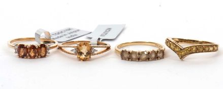 Four 9ct gemset rings: to include a 9ct five stone citirine ring with plain band hallmarked