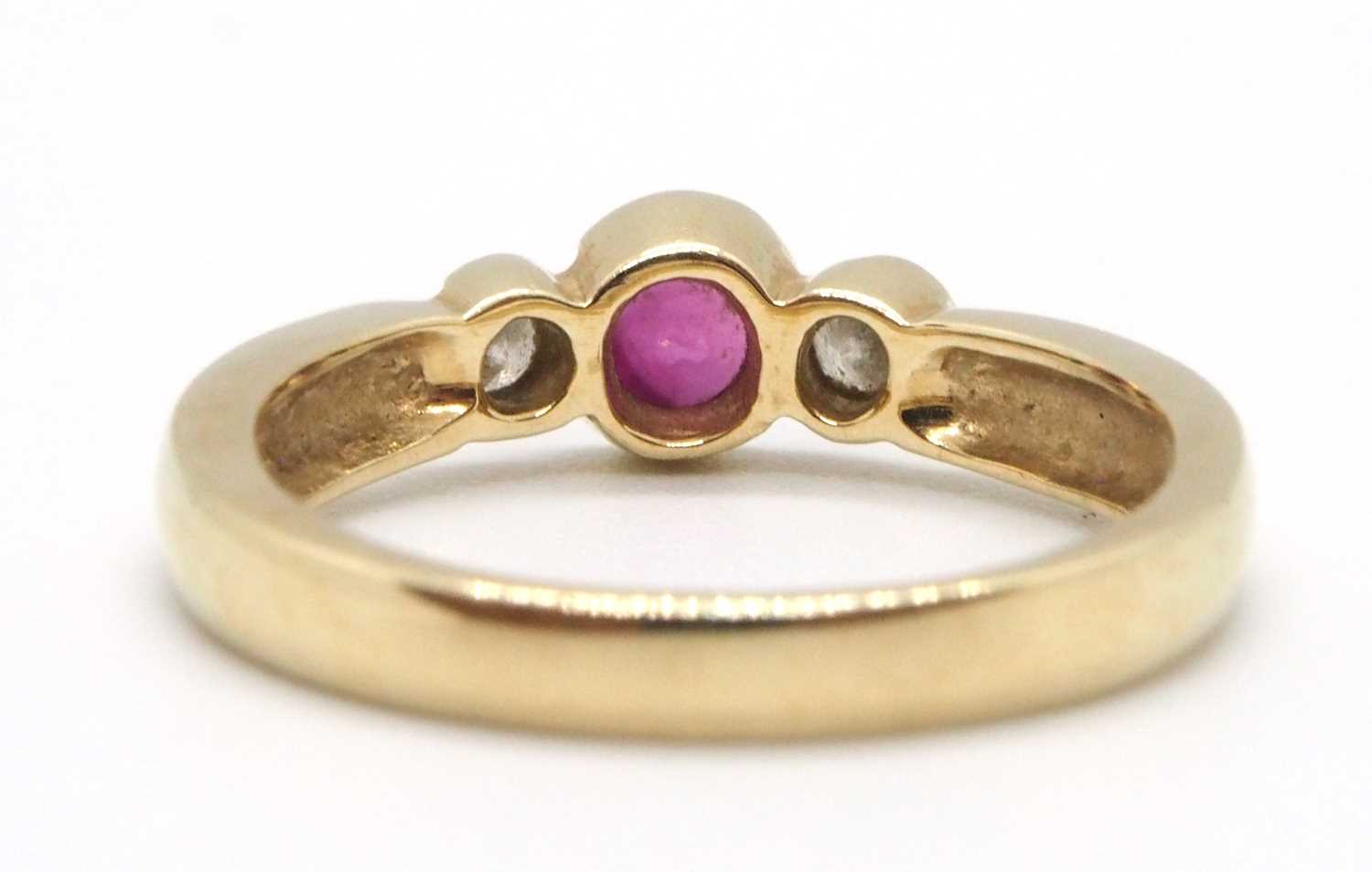 A 9ct ruby and diamond ring, the round collet mounted ruby with a round brilliant cut diamond to - Image 6 of 8