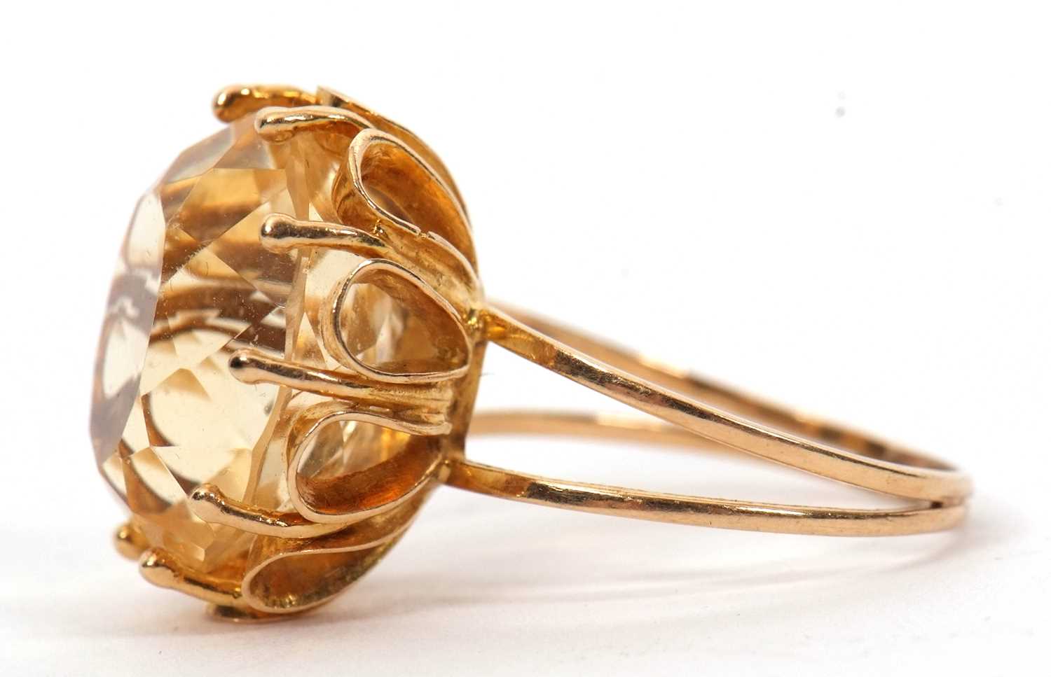 A citrine ring, the oval mixed cut citrine, approx. 16mm long, claw mounted with looped gallery, - Image 5 of 7