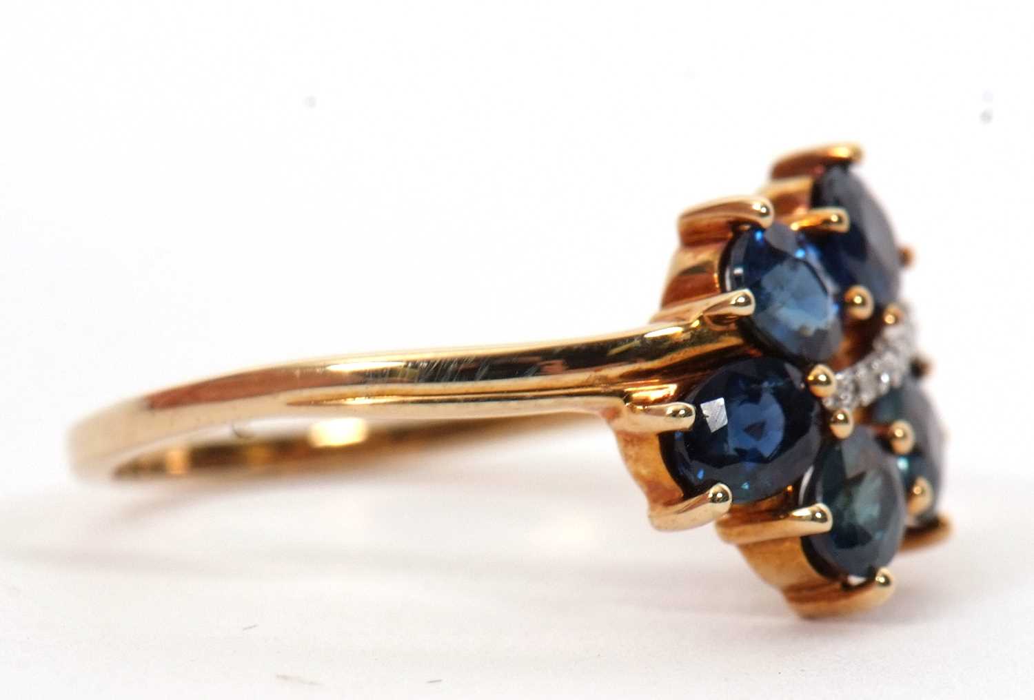 A 9ct blue stone and diamond ring, the leaf shape ring set with five oval blue stones (probably - Image 2 of 6