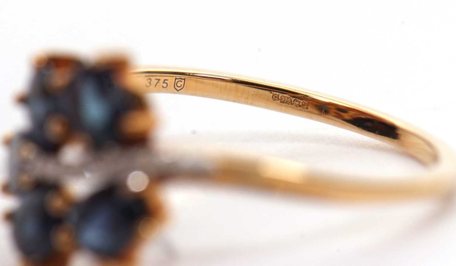 A 9ct blue stone and diamond ring, the leaf shape ring set with five oval blue stones (probably - Image 5 of 6