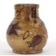 An early 18th Century pottery mug, possibly Devon slip ware decorated with tulips and dated 1743, - Image 5 of 7
