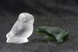 A green coloured Lalique model of a frog together with a clear and frosted glass model of an owl,