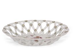 A Chelsea basket with brown anchor mark to base, decorated with flowers (some minor cracks)