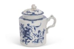 An 18th Century Worcester mustard pot and cover with floral design