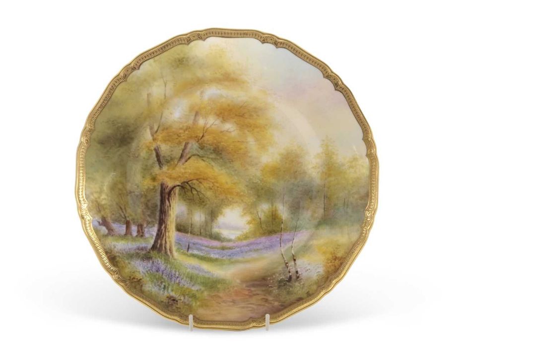 A Royal Worcester cabinet plate painted with a forest scene with bluebells, indistinctly signed - Image 1 of 4
