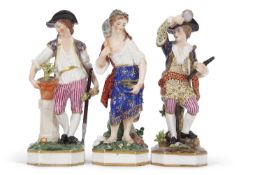 A group of three 19th Century Derby figures including a gardener and a musician and a fish seller,