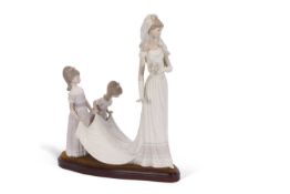 A Lladro group of a bride with bridesmaids on oval plinth designed by Jose Puche 35cms good