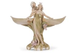 An impressive Royal Dux Art Nouveau centrepiece modelled as two maidens surrounding a central stem