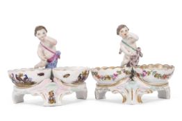 A pair of Berlin porcelain salts, the bowls decorated with birds and further salt decorated with