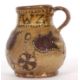 An early 18th Century pottery mug, possibly Devon slip ware decorated with tulips and dated 1743, - Image 4 of 7