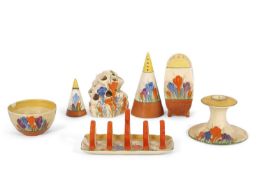 A group of Clarice Cliff crocus wares including a Bonjour shaped sifter together with a further