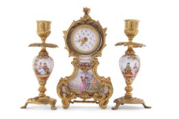 A small late 19th Century clock garniture, probably French with painted porcelain panels of