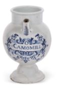 An 18th/19th Century delft drug jar probably Dutch with blue painted central cartouche and