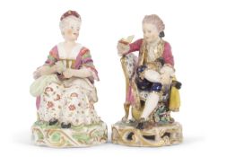 A pair of Derby figures both seated on chairs on pierced circular bases, 19th Century, one of a