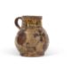 An early 18th Century pottery mug, possibly Devon slip ware decorated with tulips and dated 1743, - Image 1 of 7