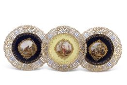 A group of three late 19th/20th Century Meissen plates, all with pierced borders including a pair of