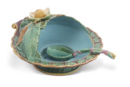 A 19th Century Minton Majolica soup tureen and ladle in typical Majolica glazes with moulded leaf