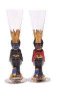A near pair of Devil Nobel Schnapps drinking glasses designed by Gunnar Cyren for Orrefors with a