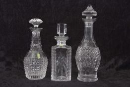 A group of three Waterford Crystal glass decanters of square and oval shapes