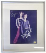 A framed and glazed colour photograph, bearing the signature of Alien: Resurrection actors Sigourney