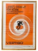 A framed reproduction one sheet poster for Alfred Hitchcock's Vertigo Framed size approximately: