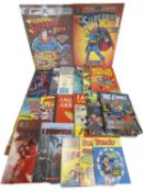 A pair of DC comic book canvas prints, together with a collection of various annuals etc