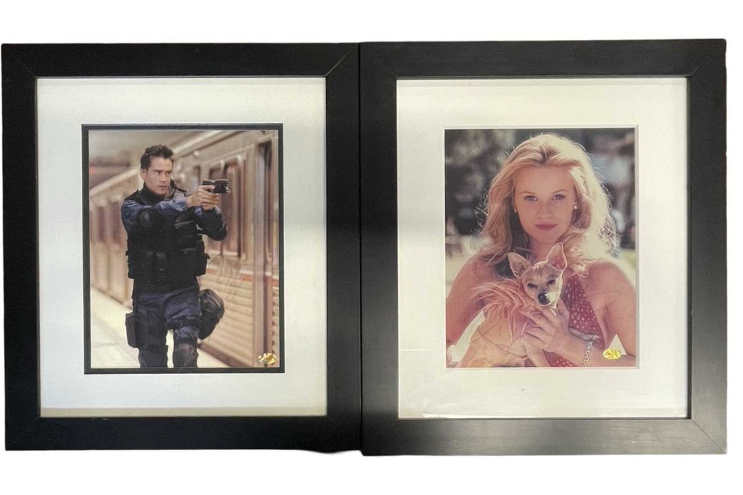 A pair of framed and glazed colour photographs, bearing the signatures of film stars Reese - Image 1 of 3