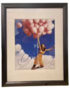 A framed and glazed colour photograph bearing the signature of Jennifer Aniston (unauthenticated