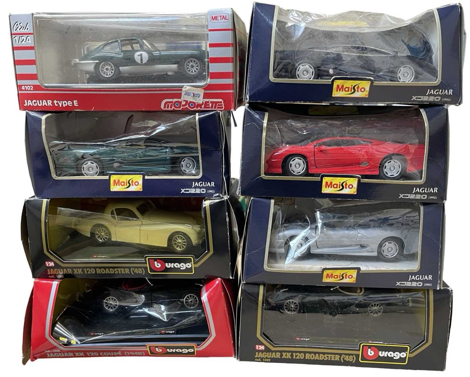 A collection of 8 various boxed 1:24 scale model cars, to include Bburago, Maisto and Majorette