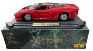 A Maisto 1:12 scale model Jaguar XJ220 (1992) in Red