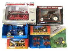A mixed lot of various boxed ERTL agricultural vehicles