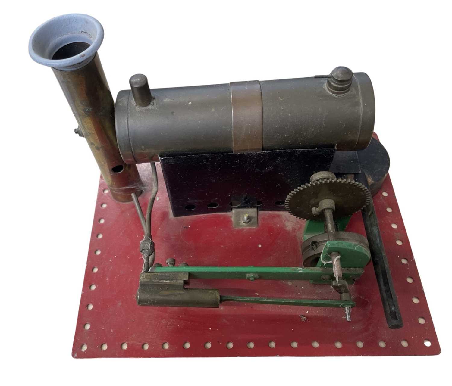 A small stationary steam boiler on base, unmarked