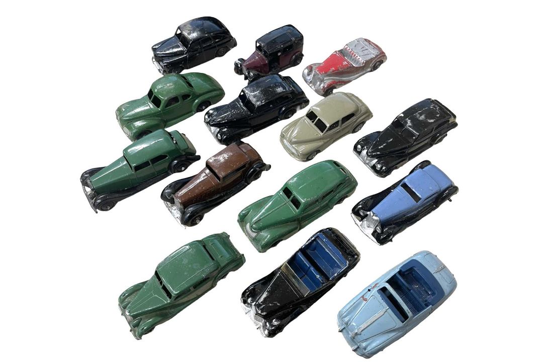 A group of playworn Dinky Toy saloons and town cars, some repainted.
