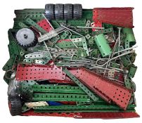 A quantity of Meccano, together with instruction manuals 1-5 and a copy of Meccano Magazine