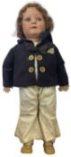 A bisque head Heubach Koppelsdorf doll, dressed in sailor's outfit. Marked to rear of head: