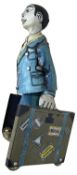 A tinplate clockwork figure, 'El Estudiante'. Some losses to paintwork and light areas of rust,