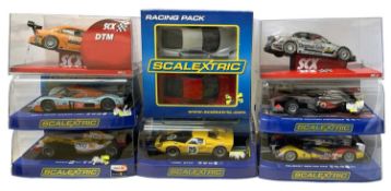A collection of various cased Scalextric cars, plus two SCX examples