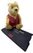 A large Steiff Winnie the Pooh bear in red waistcoat with internal growler. Limited number 02249/