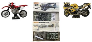 A pair of boxed Matchbox Aeroplane 1:32 scale building kits, plus a pair of built motorcycles