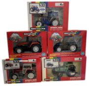 Five boxed Britains 1:32 scale tractor models, to include: - Massey Ferguson MF 3860 Double Rear