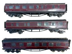 A trio of 0 gauge Basset Lowke LMS rail corridors in maroon livery. Some wear to paintwork and small