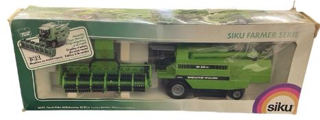 A boxed SIKU 1:16 scale model Deutz-Fahr-Mahdrescher M36.10 Combine Harvester