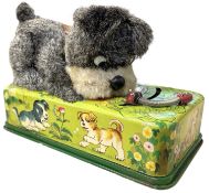 A c1950s Japanese 'Playful Puppy with Caterpillar', marked Trademark Modern Toys