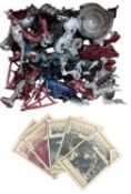 A collection of Zoids figures and some instruction manuals