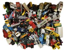 A large collection of various die-cast cars and other vehicles