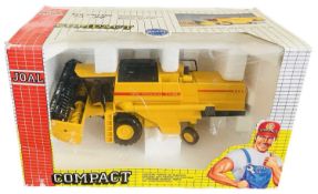 A boxed Joal New Holland TX34 Combine Harvester